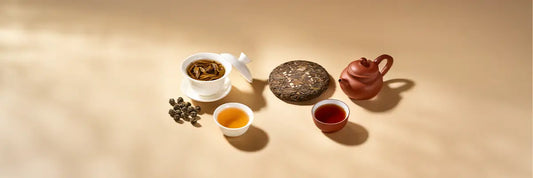 Oolong tea vs puerh tea comparison cover with loose leaves and compressed cake